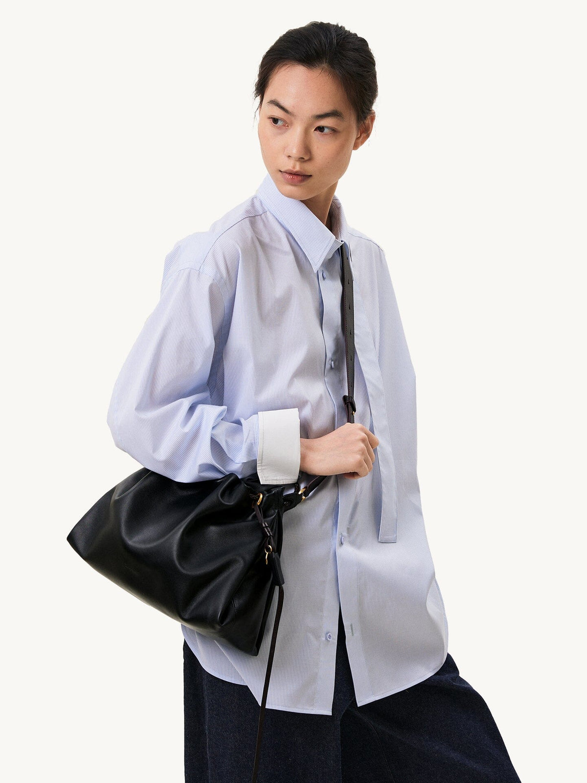 Songmont Small Gather Bag Onyx worn crossbody