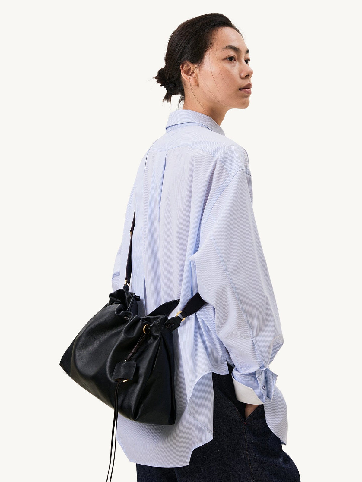 Songmont Small Gather Bag Onyx side view worn crossbody