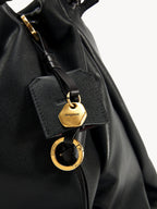 Songmont Small Gather Bag Onyx charm and gold hardware detail