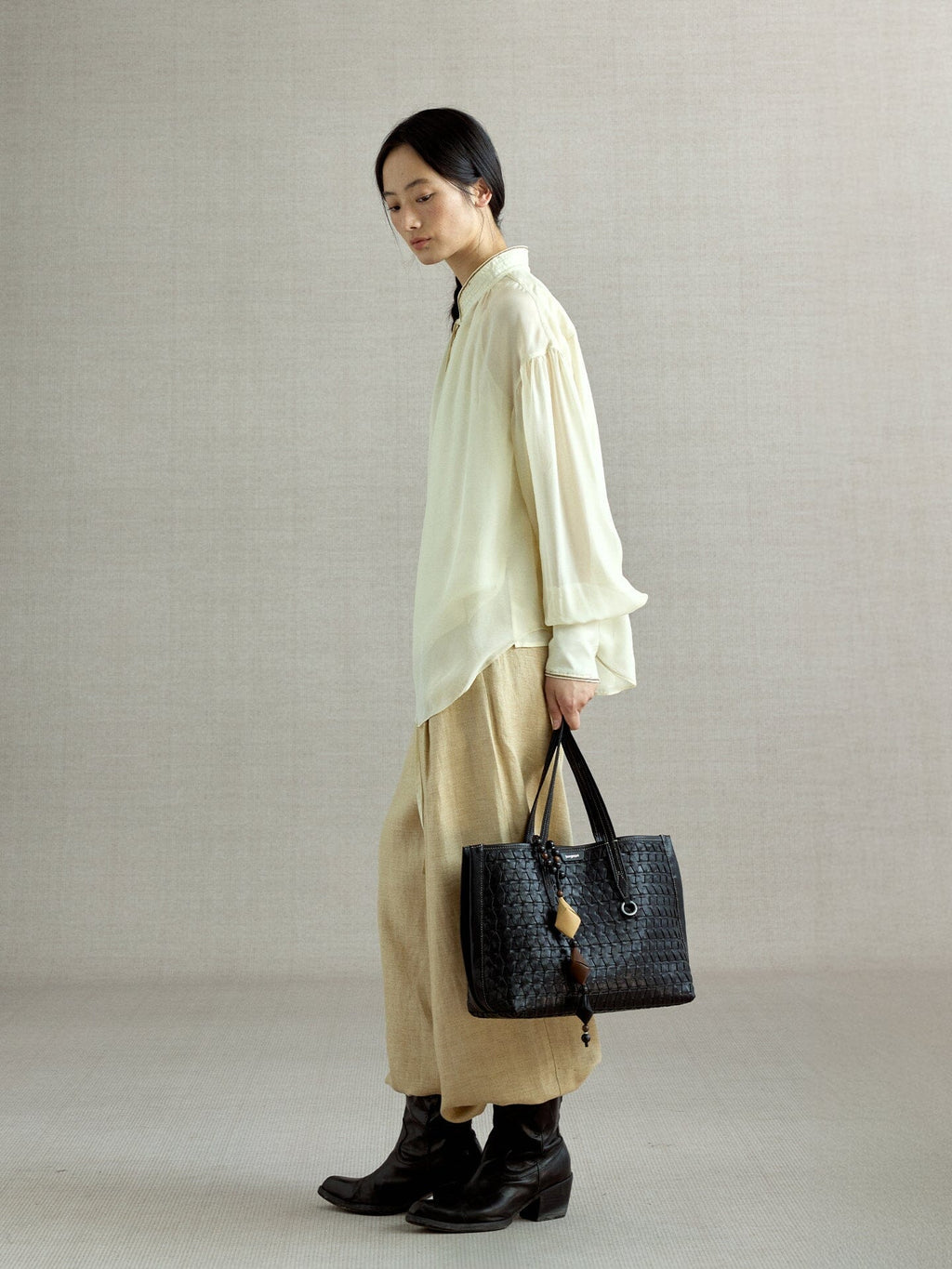 Songmont Small Lattice Tote Onyx - carried by hand