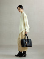 Songmont Small Lattice Tote Onyx - carried by hand