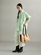 Songmont Small Lattice Tote Sulfur - carried by hand
