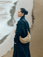 Songmont Medium Luna Hobo Bag Dune Suede - worn on the shoulder, side view