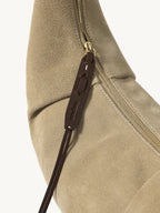Songmont Medium Luna Hobo Bag Dune Suede - zip and leather pull close-up
