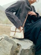 Songmont Small Shan Satchel Bag Canvas worn seated