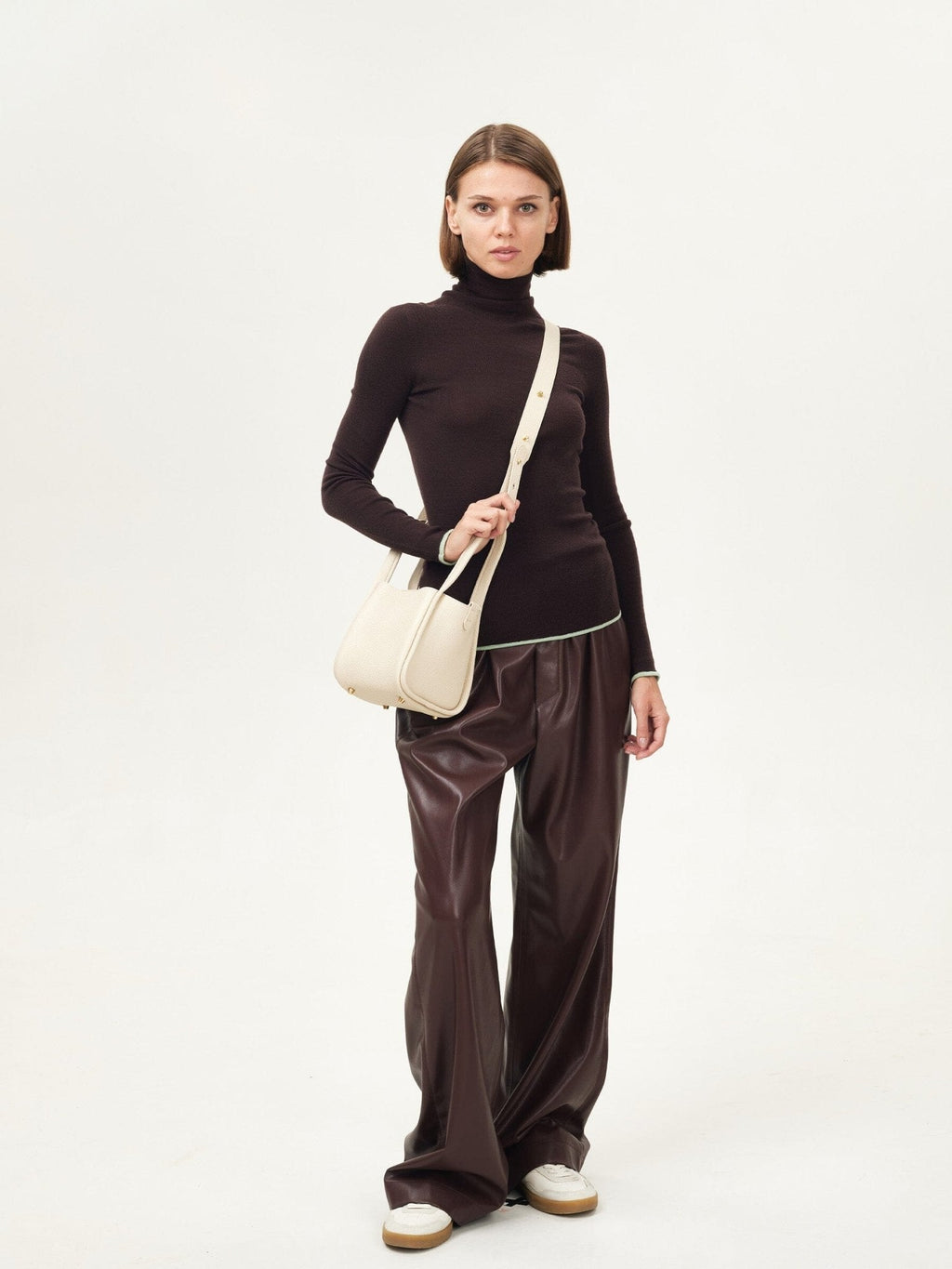 Songmont Small Song Bag Ivory - worn with the shoulder strap