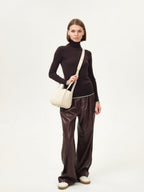 Songmont Small Song Bag Ivory - worn with the shoulder strap