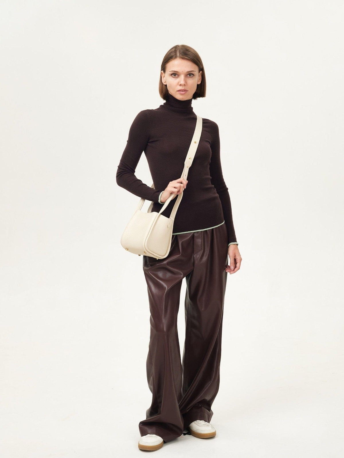 Songmont Small Song Bag Ivory - worn with the shoulder strap