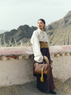 Songmont Small Yore Duffle Bag Sandal - worn with the strap, yellow tassel attached