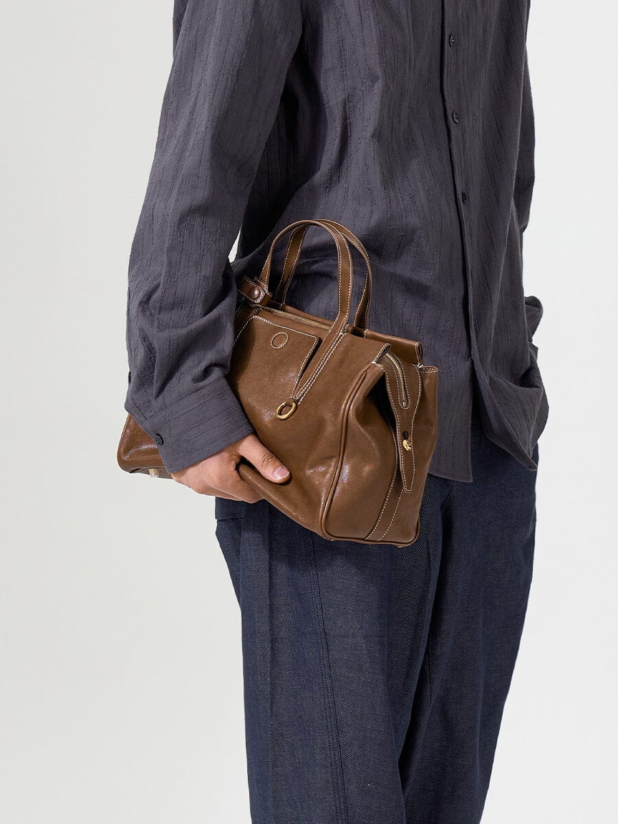 Songmont Small Yore Duffle Bag Sandal - held at the side by the top handles