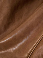 Songmont Small Yore Duffle Bag Sandal - close-up of glossy tan leather