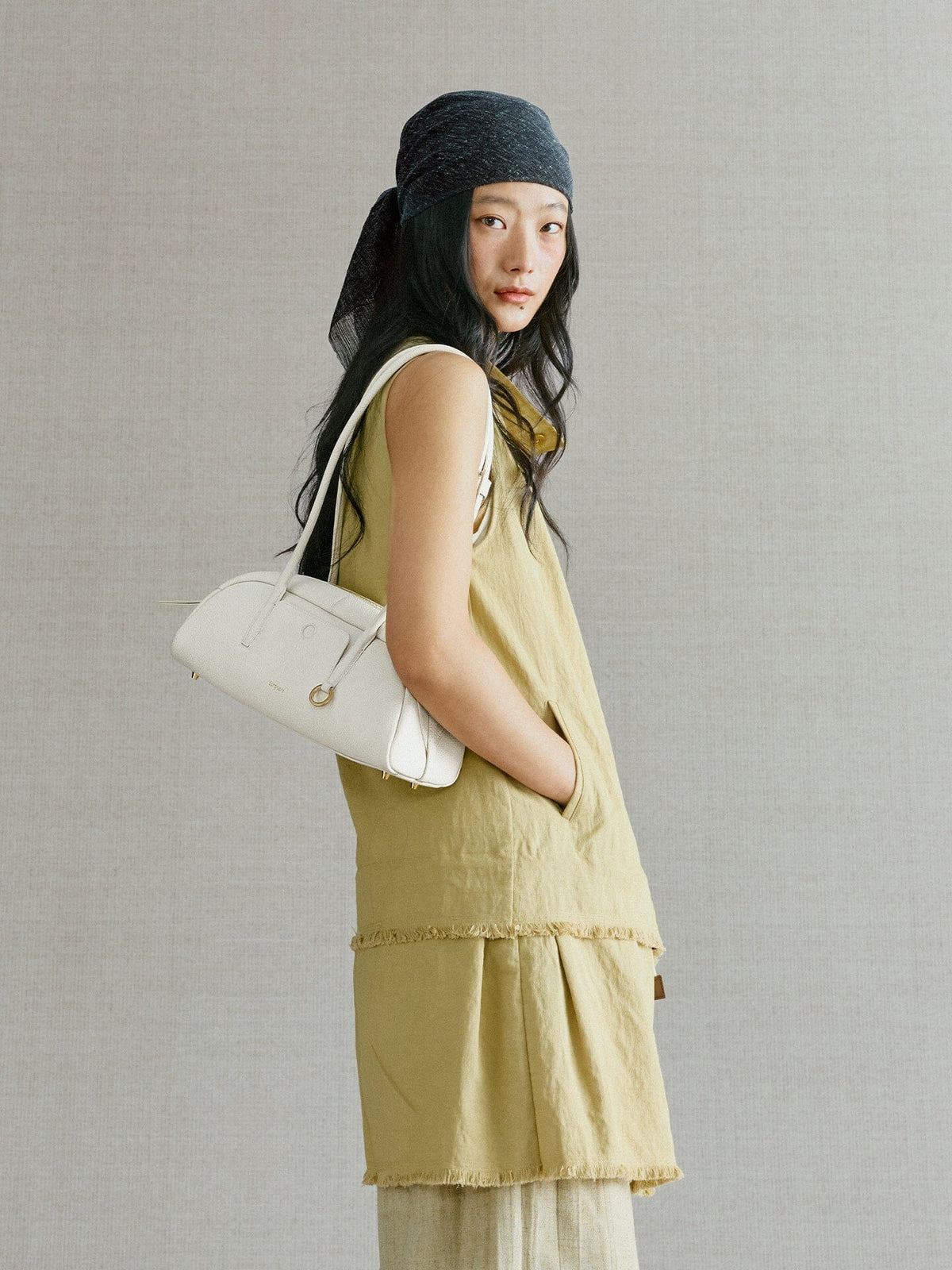 Songmont Small Yore Toast Bag Cloud - worn on the shoulder, side view