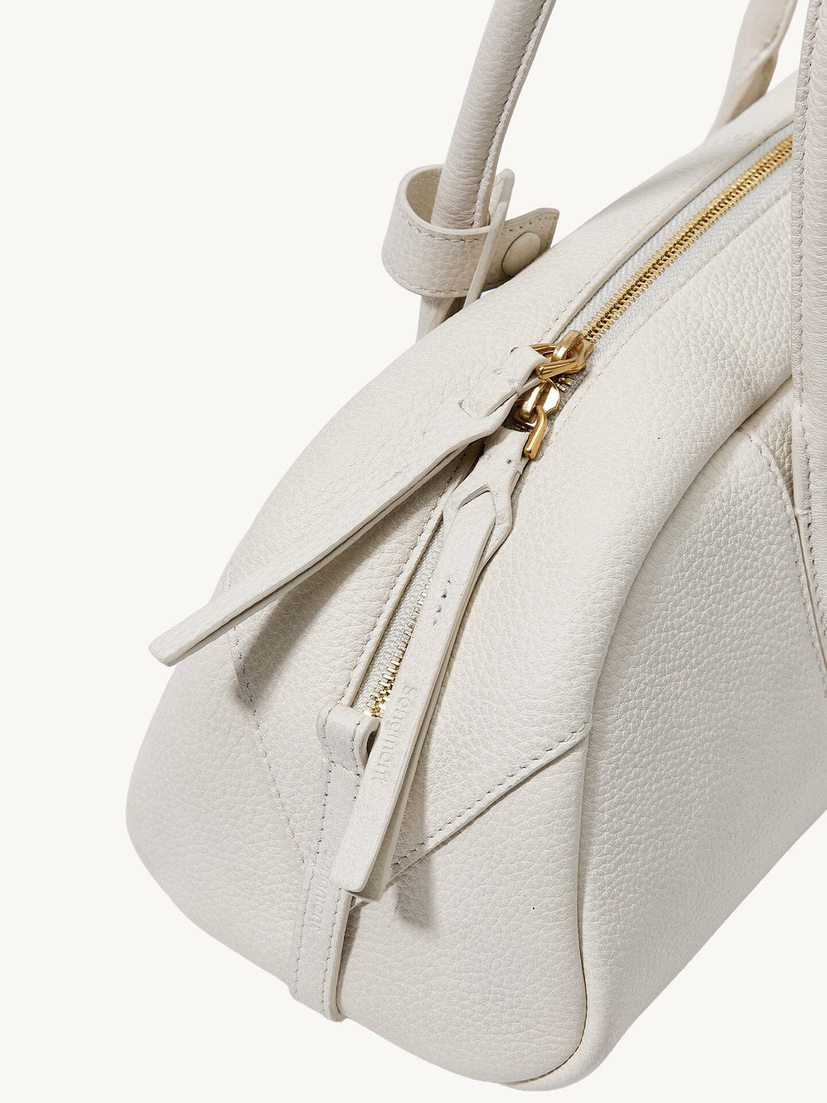 Songmont Small Yore Toast Bag Cloud - close-up of gold zip pull and strap