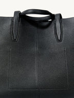 Songmont Small Yore Tote Bag Onyx - close-up of the top handle and stitched leather