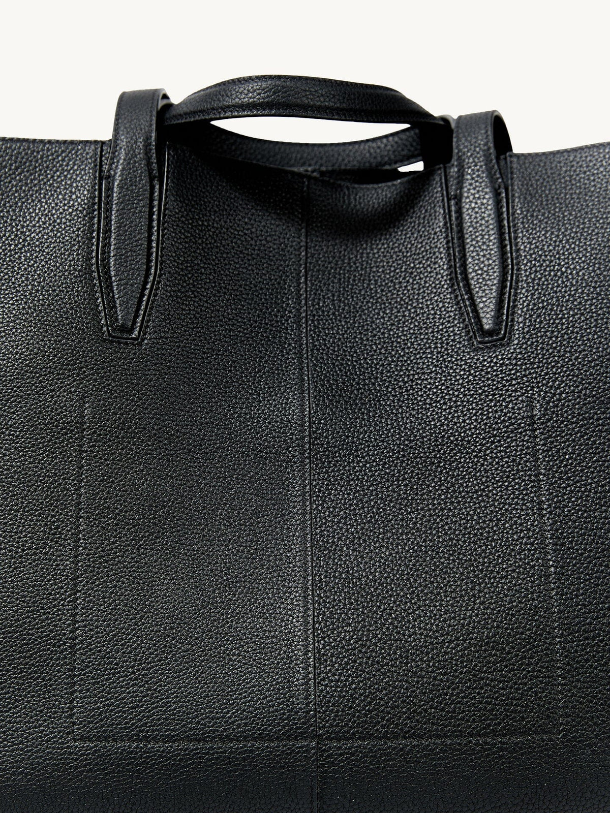 Songmont Small Yore Tote Bag Onyx - close-up of the top handle and stitched leather