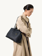 Songmont Small Yore Tote Bag Onyx - worn on the shoulder, side view