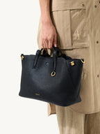 Songmont Small Yore Tote Bag Onyx - carried by the top handle