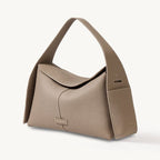 Songmont Drippy Roof Bag Cobble - sandy greige leather shoulder bag, three-quarter view