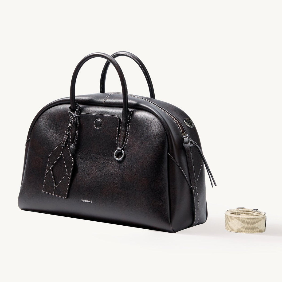 Songmont Large Yore Bowling Bag Ebony - front three-quarter view with woven strap