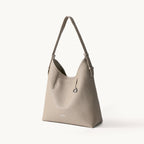Songmont Medium Yore Shoulder Bag Smoke Grey - front three-quarter view on white