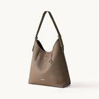Songmont Medium Yore Shoulder Bag Stone - front three-quarter view on white