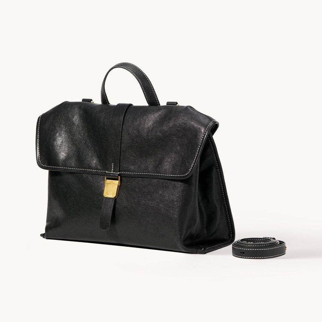 Songmont Small Shan Backpack Onyx - black leather backpack with book clasp and strap