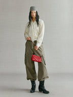 Songmont Winding Underarm Bag Lucky Red - full-length styling with cream knit and boots