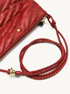 Songmont Winding Underarm Bag Lucky Red - braided strap coiled beside the zip corner