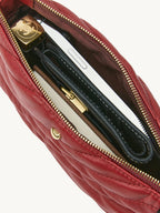 Songmont Winding Underarm Bag Lucky Red - open interior holding phone, wallet and notebook