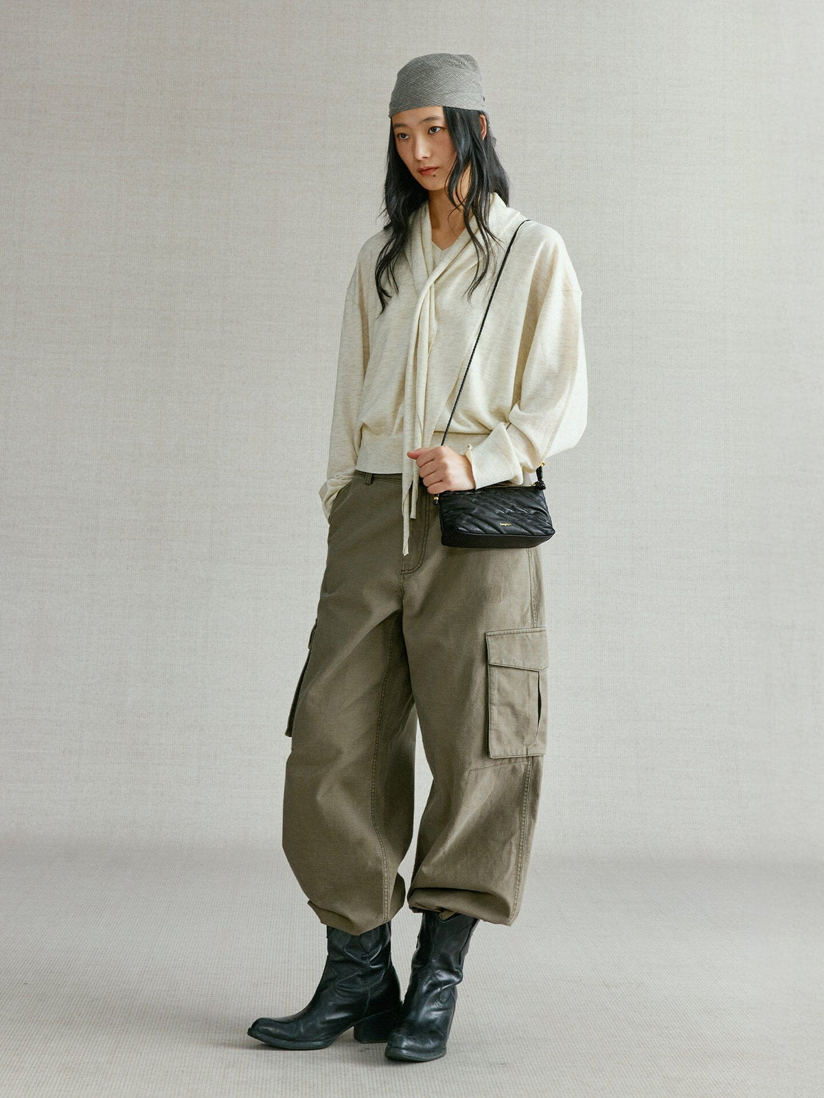 Songmont Winding Underarm Bag Onyx - full-length styling with cream knit and boots