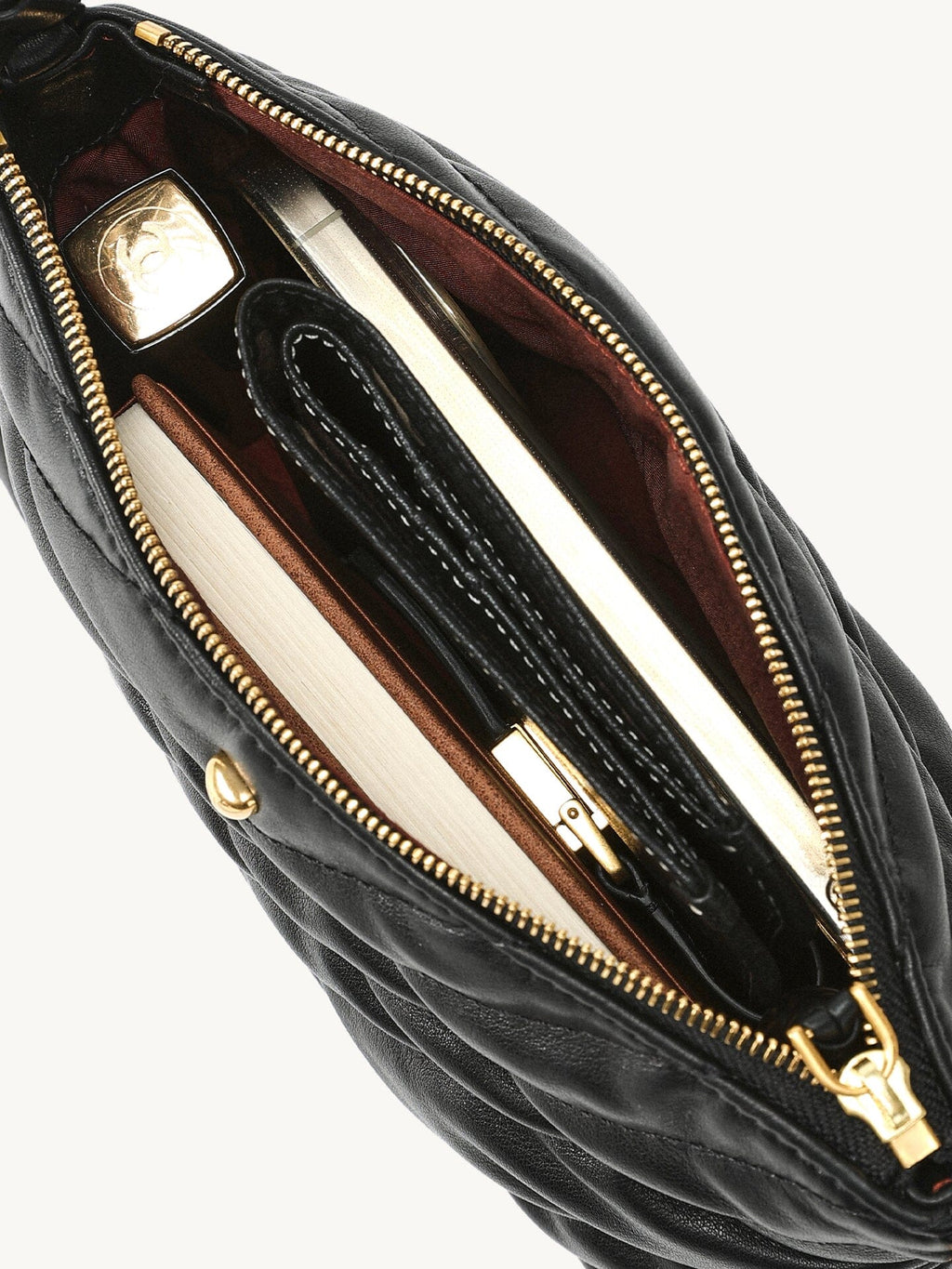 Songmont Winding Underarm Bag Onyx - open interior holding wallet, notebook and small items