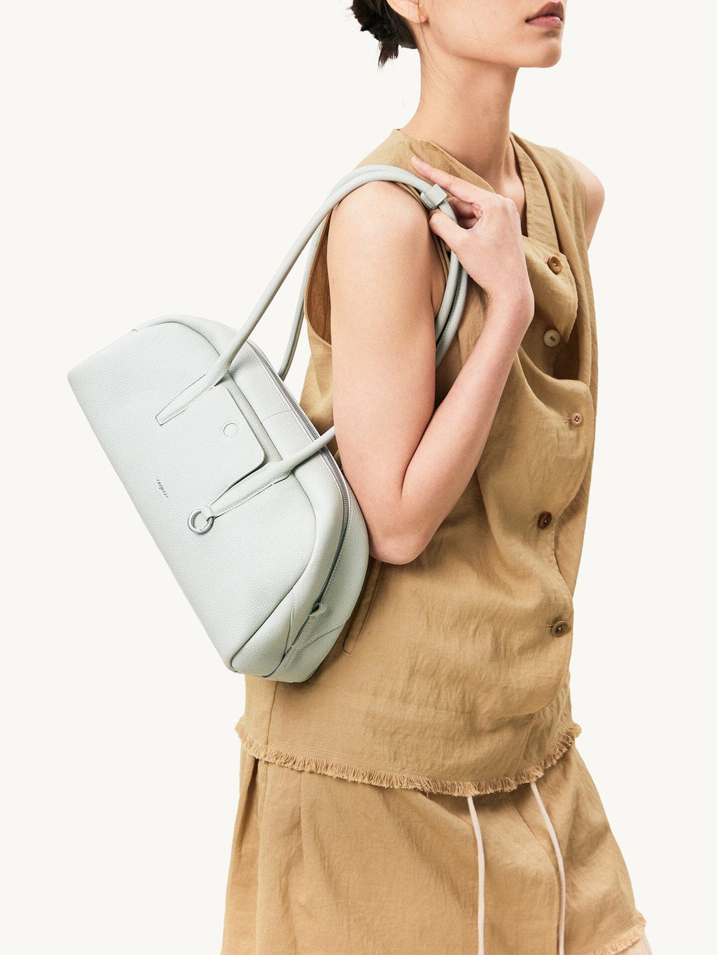 Songmont Yore Toast Bag Celeste - worn on the shoulder, side view
