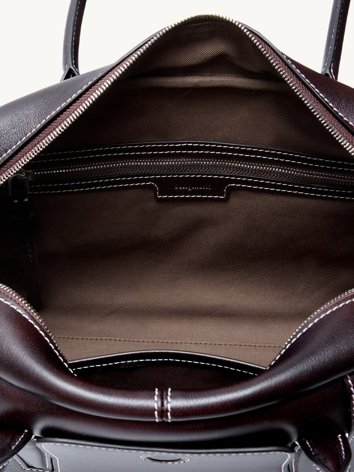 Songmont Yore Toast Bag Ebony - open interior with brown fabric lining